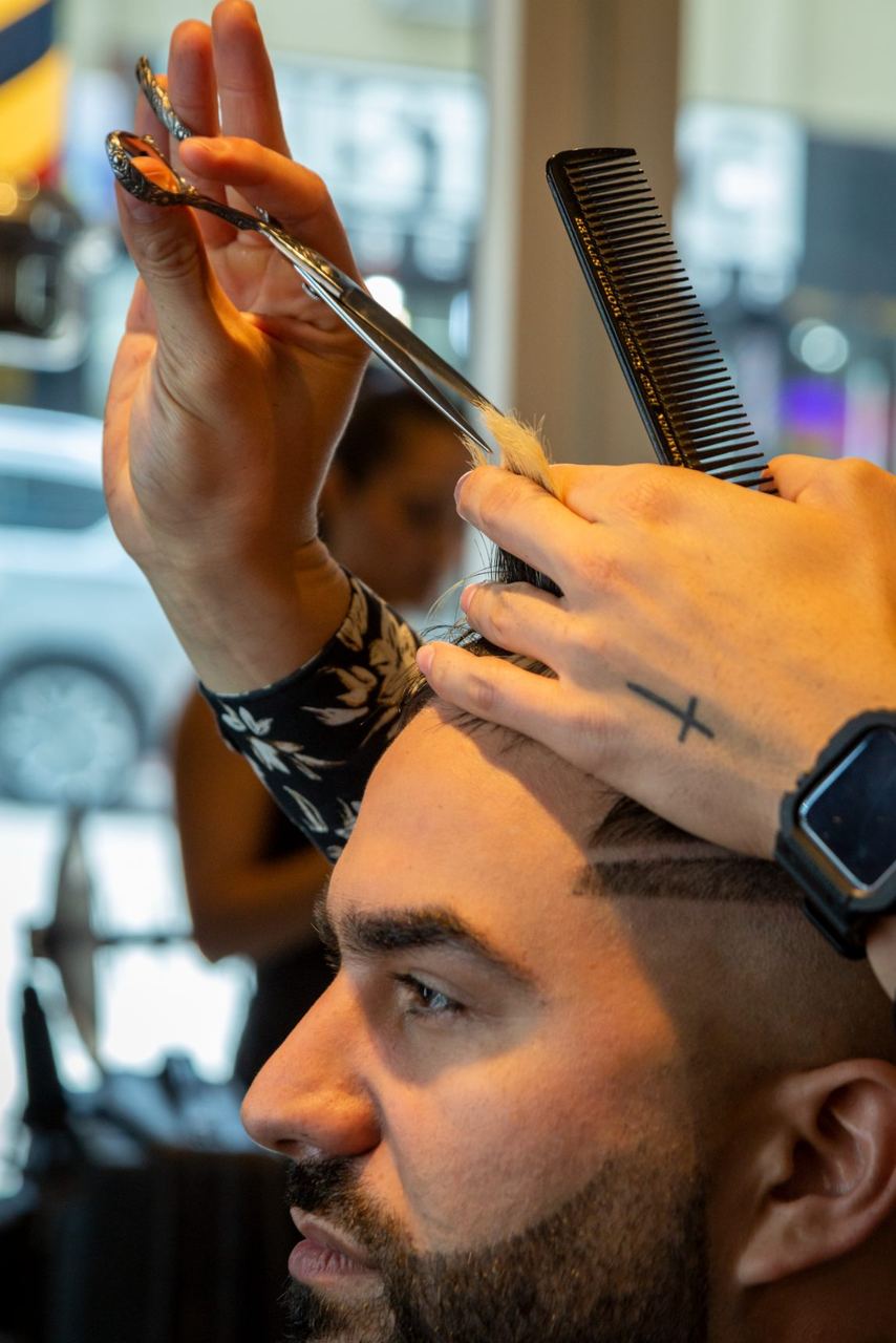 Scissor-over-comb work at the hairline