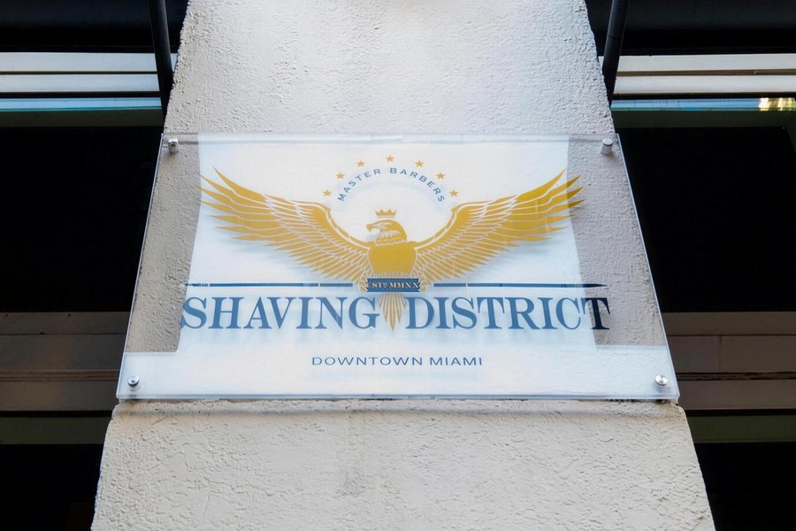 Shaving District name plate on the storefront wall, NE 2nd St, Downtown Miami